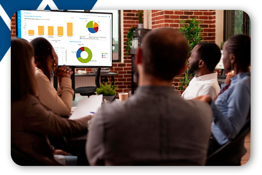 People in a meeting looking at data to make decisions about the workplace.